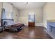 Spacious bedroom with hardwood floors and fireplace at 6860 Main St, Lithonia, GA 30058