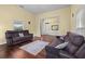 Bright living room featuring hardwood floors and ample natural light at 6860 Main St, Lithonia, GA 30058
