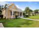 Charming house exterior with a well-maintained lawn at 6860 Main St, Lithonia, GA 30058