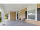 Inviting front porch with two chairs, offering a relaxing spot at 6860 Main St, Lithonia, GA 30058