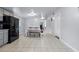 Kitchen with gray cabinets, black appliances, and tile flooring at 6860 Main St, Lithonia, GA 30058