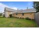 Rear view of the house, showcasing the side yard at 6860 Main St, Lithonia, GA 30058