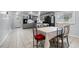Combined kitchen and dining area with a tile floor at 6860 Main St, Lithonia, GA 30058