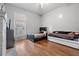 Bedroom with hardwood floors, a bed, and a daybed at 6860 Main St, Lithonia, GA 30058