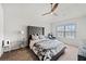 Spacious main bedroom with a large bed, ceiling fan, and neutral decor at 5410 Whisper Ct, Cumming, GA 30028