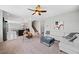 Spacious living room with L-shaped sofa, a coffee table, and large windows at 5410 Whisper Ct, Cumming, GA 30028