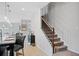 Modern staircase with metal balusters in a home with an open floor plan at 5410 Whisper Ct, Cumming, GA 30028