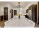 Kitchen dining area with white quartz table and modern chandelier at 330 Heatherden Ave, Fayetteville, GA 30214