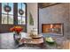 Close-up of a modern gas fireplace with decorative glass at 330 Heatherden Ave, Fayetteville, GA 30214