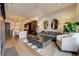 Open concept living room with hardwood floors and a view into the kitchen at 330 Heatherden Ave, Fayetteville, GA 30214