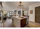 Open kitchen features a large island, hardwood floors, and a view into the living area at 330 Heatherden Ave, Fayetteville, GA 30214