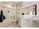 Bathroom with double vanity, a bathtub, and a glass shower at 330 Heatherden Ave, Fayetteville, GA 30214