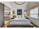 Bright bedroom with a king-size bed, large artwork, and an ensuite bathroom at 330 Heatherden Ave, Fayetteville, GA 30214