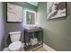 Stylish powder room with concrete vanity, frameless mirror, and LED backlighting at 330 Heatherden Ave, Fayetteville, GA 30214