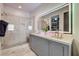 Modern bathroom with double vanity and a frameless glass shower at 330 Heatherden Ave, Fayetteville, GA 30214