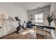 Home office with Peloton bike, desk, and hardwood floors at 330 Heatherden Ave, Fayetteville, GA 30214