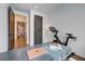 Home office with Peloton bike, desk, and hardwood floors at 330 Heatherden Ave, Fayetteville, GA 30214