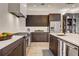 Modern kitchen with stainless steel appliances and dark cabinets at 330 Heatherden Ave, Fayetteville, GA 30214