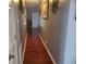 Hardwood floor hallway with neutral-toned walls at 1301 Fairington Village Dr, Lithonia, GA 30038