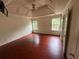Spacious bedroom with hardwood floors and a tray ceiling at 3393 Madison Farm Way, Snellville, GA 30039
