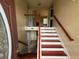 Two-story entryway with staircase and hardwood floors at 3393 Madison Farm Way, Snellville, GA 30039