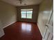 Bedroom with hardwood floors and large window at 3393 Madison Farm Way, Snellville, GA 30039