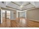 Main bedroom with hardwood floors, tray ceiling, and ensuite bathroom access at 5061 Belair Bluff Se Ct, Mableton, GA 30126