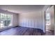 Spacious dining room with hardwood floors and large windows at 4205 Old House Dr, Conley, GA 30288