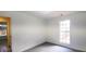 Bright bedroom with window and neutral walls at 4205 Old House Dr, Conley, GA 30288