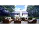 Relaxing patio with outdoor furniture and fire pit at 4205 Old House Dr, Conley, GA 30288