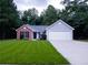 Two-toned house exterior with a driveway at 4205 Old House Dr, Conley, GA 30288