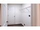 Bright laundry room with built-in shelving and vinyl flooring at 4205 Old House Dr, Conley, GA 30288