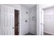 Shower with gray tile and pebble floor at 4205 Old House Dr, Conley, GA 30288