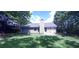 Ranch-style home with a nicely landscaped backyard at 4205 Old House Dr, Conley, GA 30288