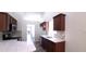 Modern kitchen with dark cabinets and white countertops at 4205 Old House Dr, Conley, GA 30288