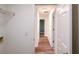 Clean hallway with wood-look floors and access to bedrooms at 4205 Old House Dr, Conley, GA 30288