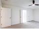 Bright bedroom with double doors and ceiling fan at 4205 Old House Dr, Conley, GA 30288
