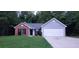 Two-toned house exterior with a driveway at 4205 Old House Dr, Conley, GA 30288
