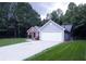 Two-toned house exterior with a driveway at 4205 Old House Dr, Conley, GA 30288