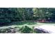 Large backyard with grassy area and patio at 4205 Old House Dr, Conley, GA 30288