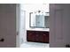 Bathroom with double vanity and large mirror at 4205 Old House Dr, Conley, GA 30288