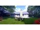Spacious backyard with patio furniture and lush lawn at 4205 Old House Dr, Conley, GA 30288