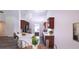 Modern kitchen with wood cabinets and eat-in island at 4205 Old House Dr, Conley, GA 30288