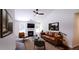 Cozy living room with leather sofa and fireplace at 4205 Old House Dr, Conley, GA 30288