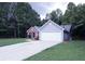 Two-toned house exterior with a driveway at 4205 Old House Dr, Conley, GA 30288