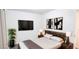 Modern bedroom with mounted TV and wood accents at 4205 Old House Dr, Conley, GA 30288