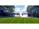 Ranch-style home with a nicely landscaped backyard at 4205 Old House Dr, Conley, GA 30288