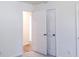 Bedroom with double doors and access to hallway at 4205 Old House Dr, Conley, GA 30288