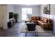 Living room with sectional sofa and large window at 4205 Old House Dr, Conley, GA 30288