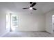 Spacious bedroom with ceiling fan and large windows at 4205 Old House Dr, Conley, GA 30288